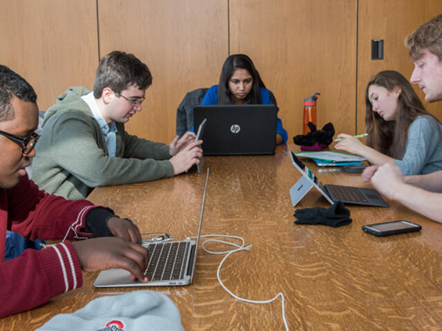 Students studying around a table